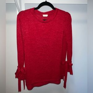 Red sweater with bow tie sleeves